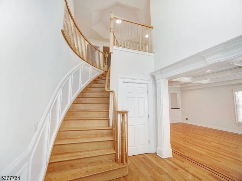 Welcome to this stunning custom Colonial home that perfectly combines timeless elegance with modern comfort.