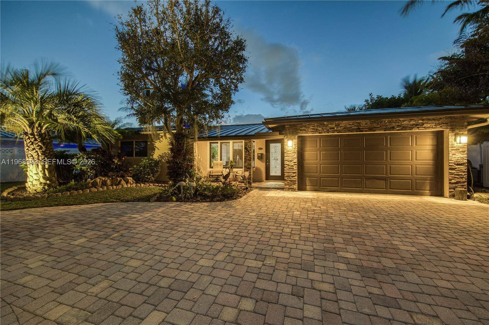 Exceptional wide canal waterfront residence located at the end of a cul de sac in Garden Isles, offering breathtaking water views and outstanding ocean access.