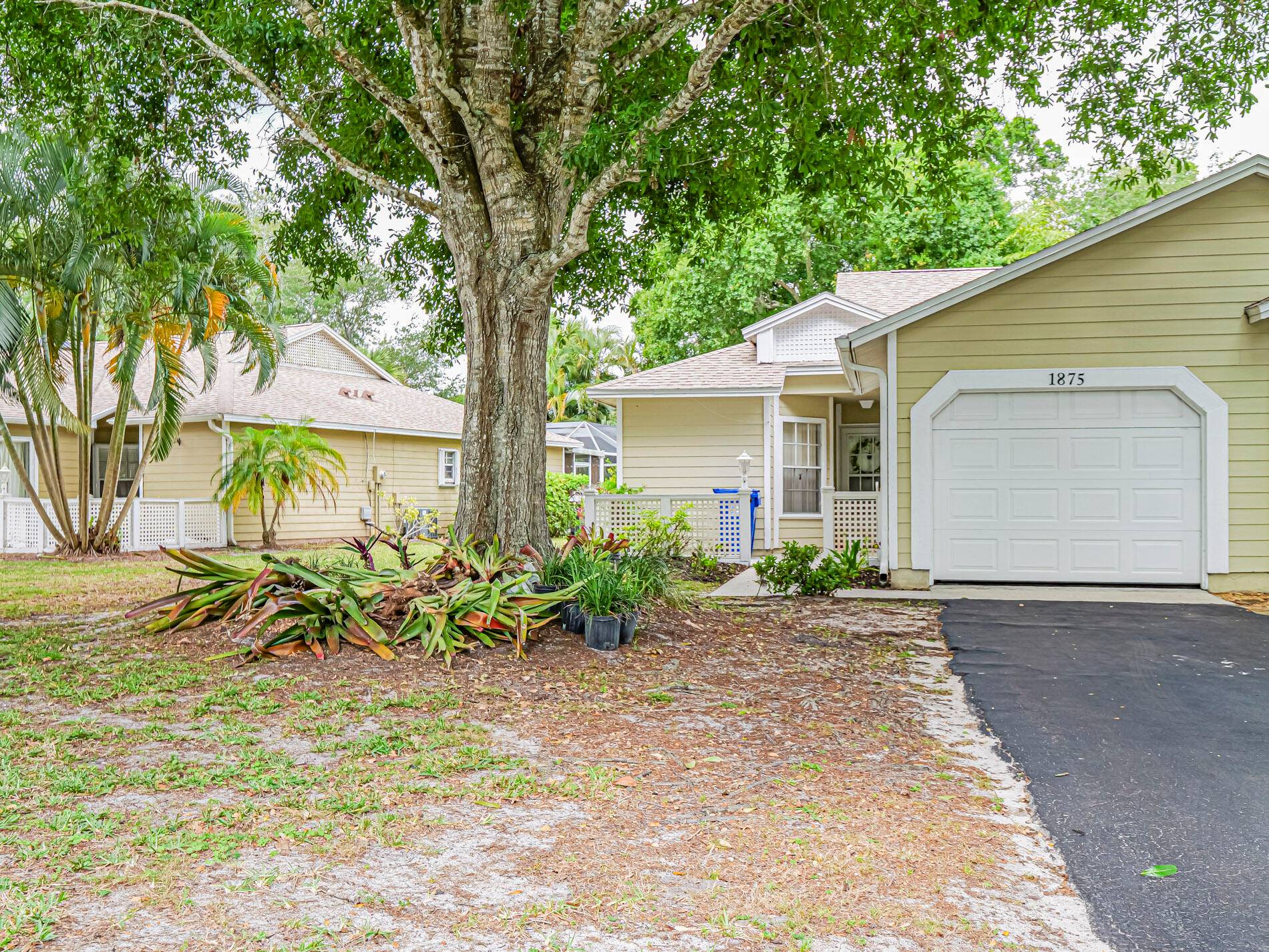2 2 1 with Large Private Screened Porch, Vaulted Ceiling New Roof and Exterior Paint, Gated Community with low HOA Fee.