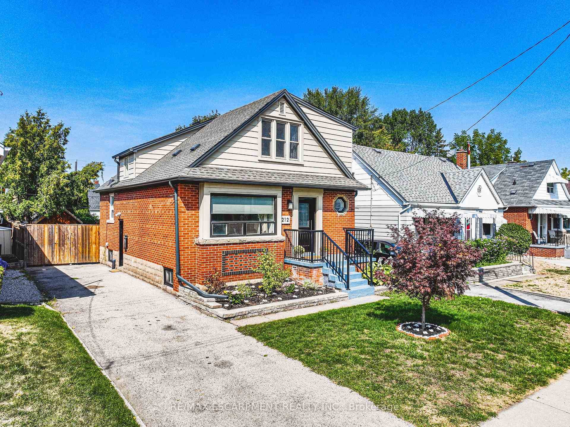 Discover this charming property at 212 Rodgers Road, a stunning detached home that seamlessly blends historic brick curb appeal with modern upgrades.