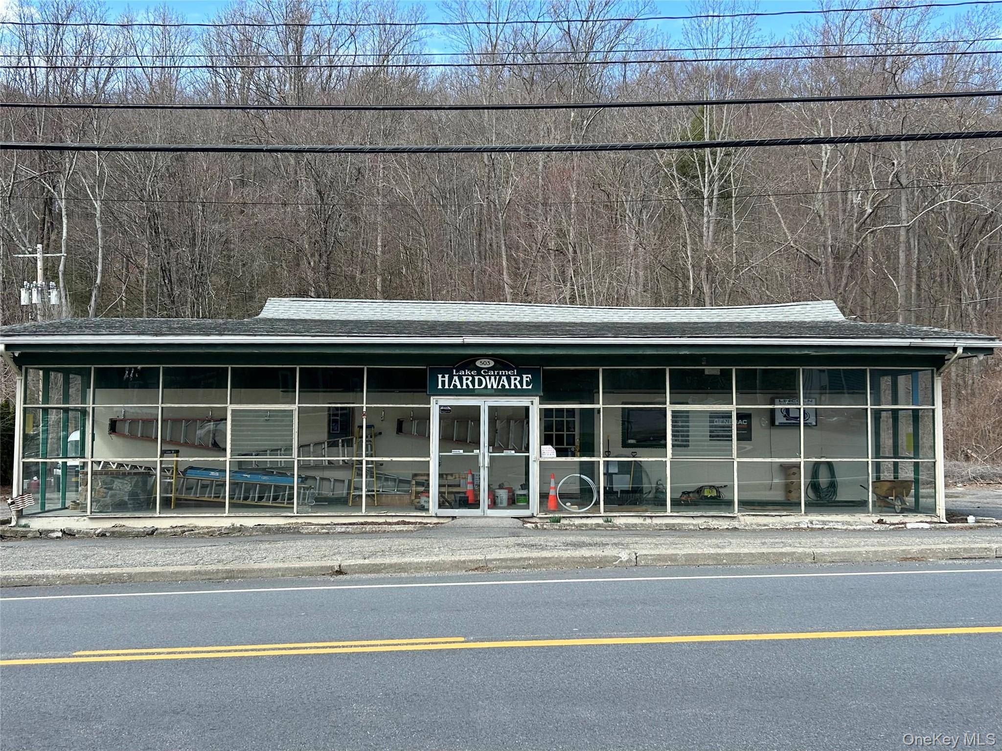 THREE Commercial Buildings with one of them containing a one bedroom Residential unit.