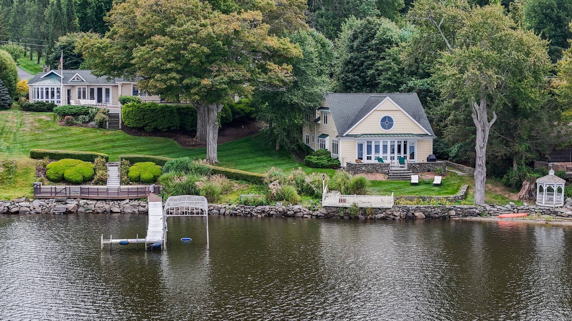 Lakefront estate consisting of 2 separately deeded properties set on 2.