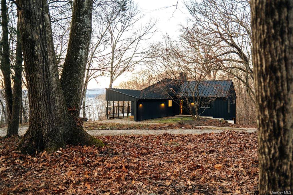 At the end of a long private drive, on the site of the Hopeland House, one of Staatsburg's Historic Guilded Era mansions, find a stylishly updated mid century home with ...