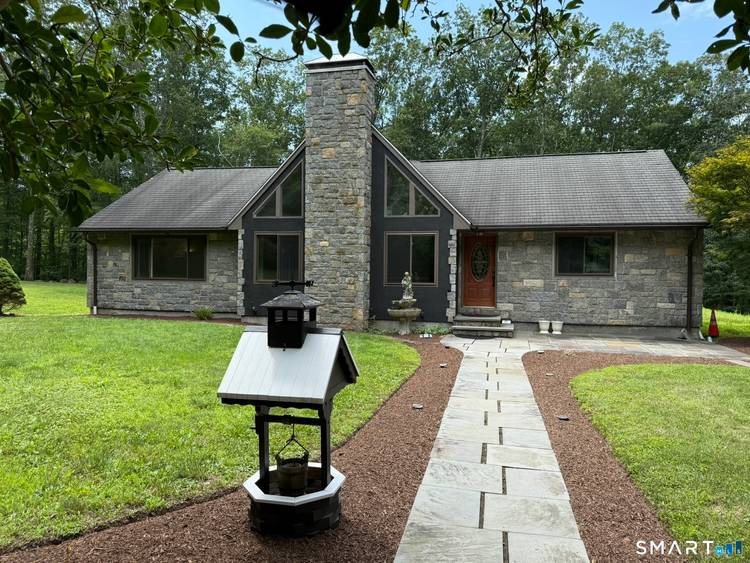Privacy abounds in this beautifully maintained single family home set on over 2 acres of serene land.