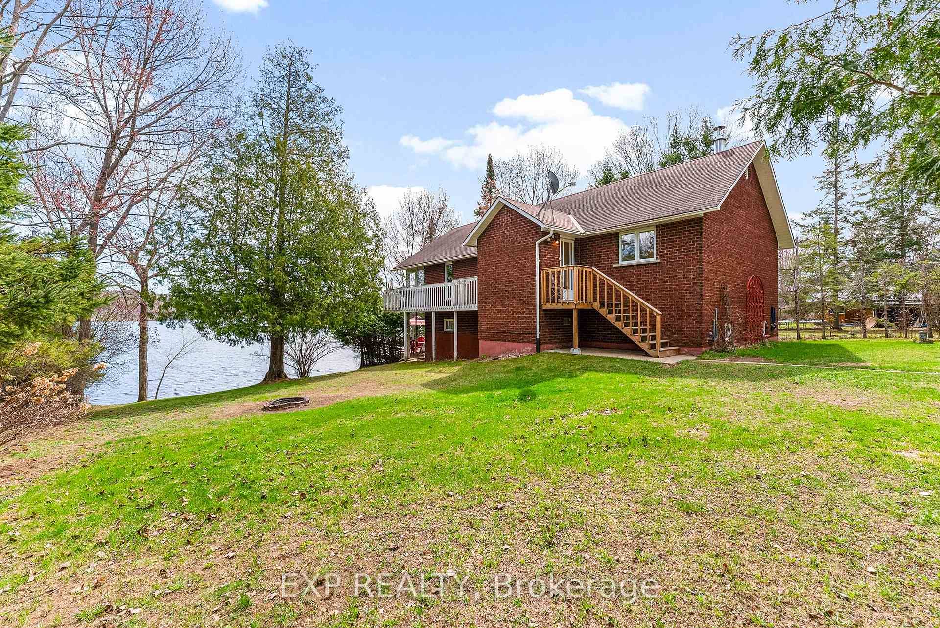 Welcome to this beautifully maintained 2 bedroom, 2 bathroom brick bungalow nestled on a serene riverfront with access to Golden lake.