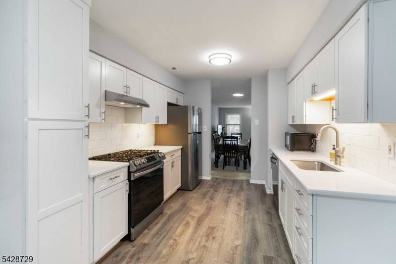 Beautifully updated end unit townhouse with exceptional natural light throughout.
