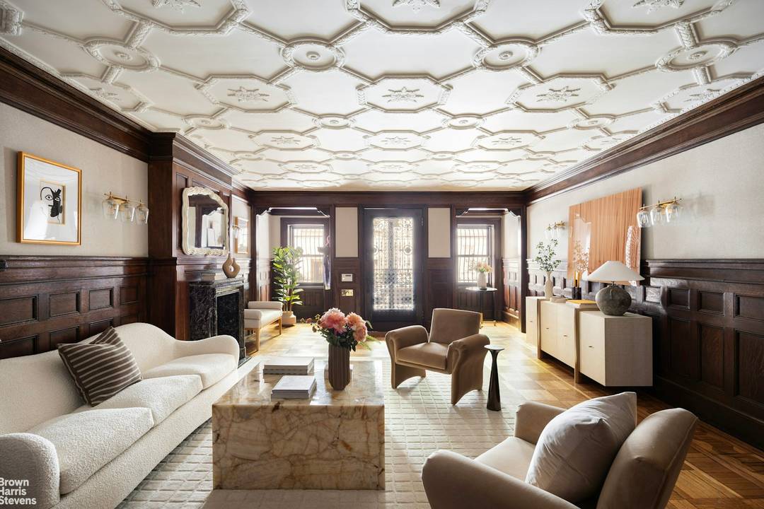 Built at the turn of the century by renowned architects Buchman and Deisler, this stately limestone townhouse sits on a historic landmark block between Madison and Park Avenues.