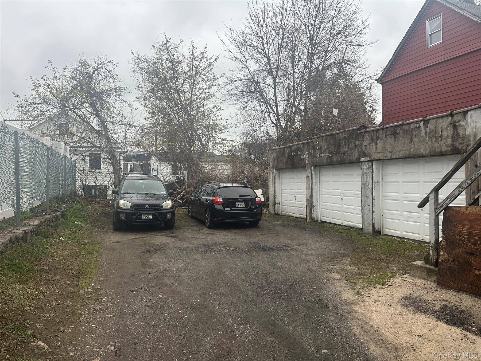 High rental income two family property with 3 car garage.