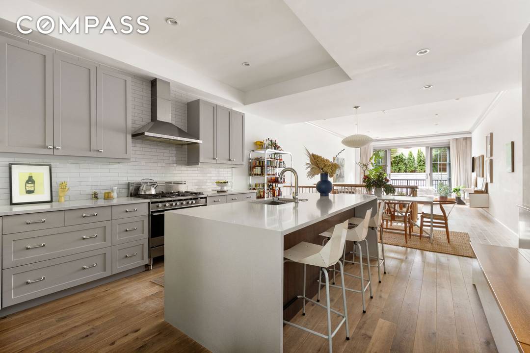 Welcome home to Residence 1B in the Lefferts Place Mews condominium a bespoke stretch of townhouse living on Lefferts Place.