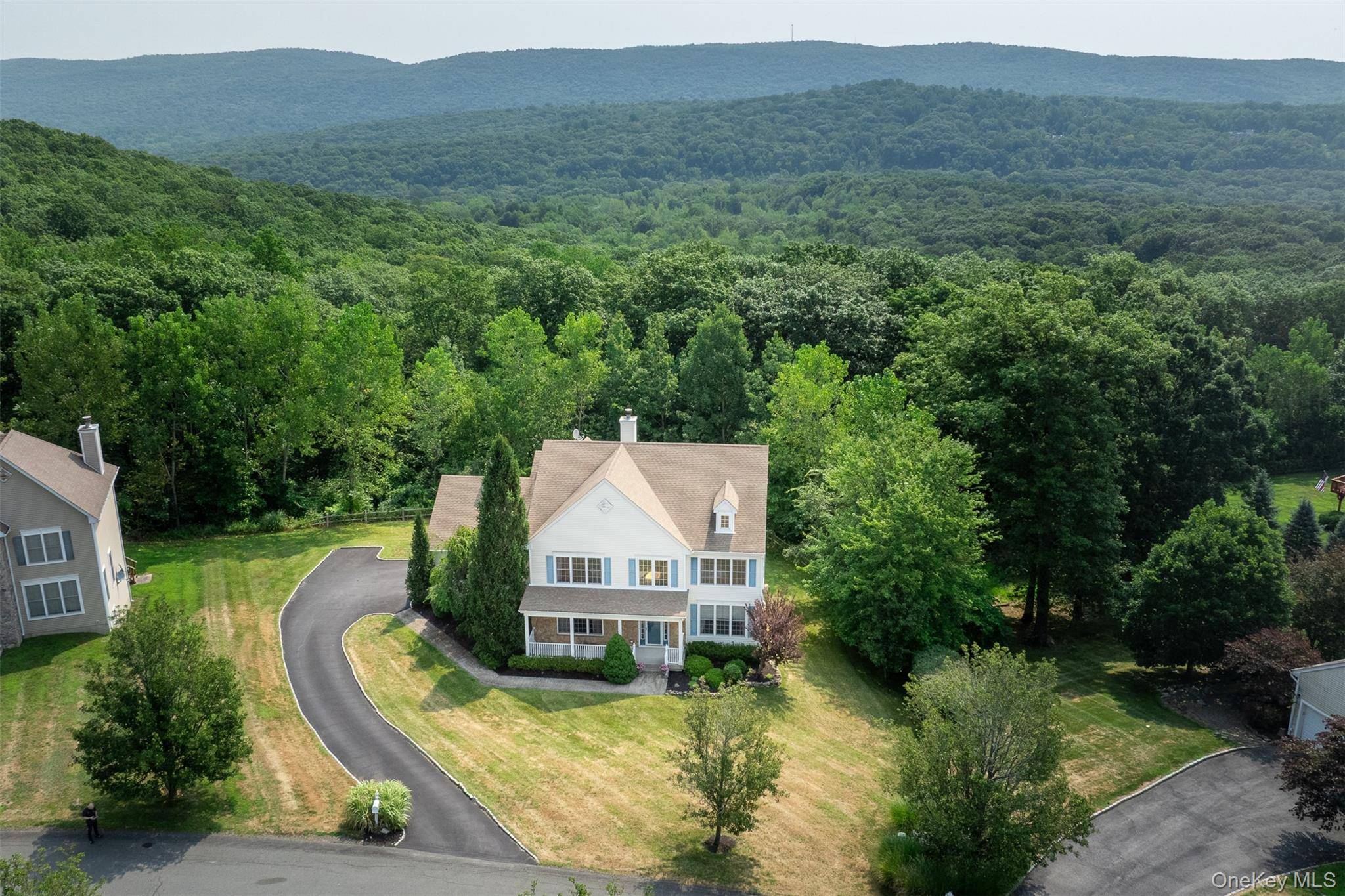 Located in the sought after Brigadoon community, this well cared for Colonial residence rests on a serene and landscaped 2.