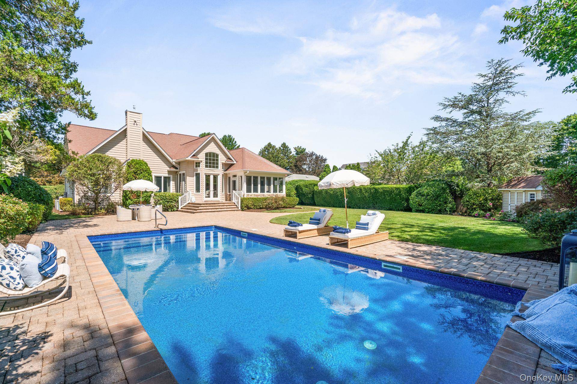Welcome to 18 Quaker Path an extraordinary custom built residence where timeless design meets modern sophistication in one of Huntington s most coveted enclaves.