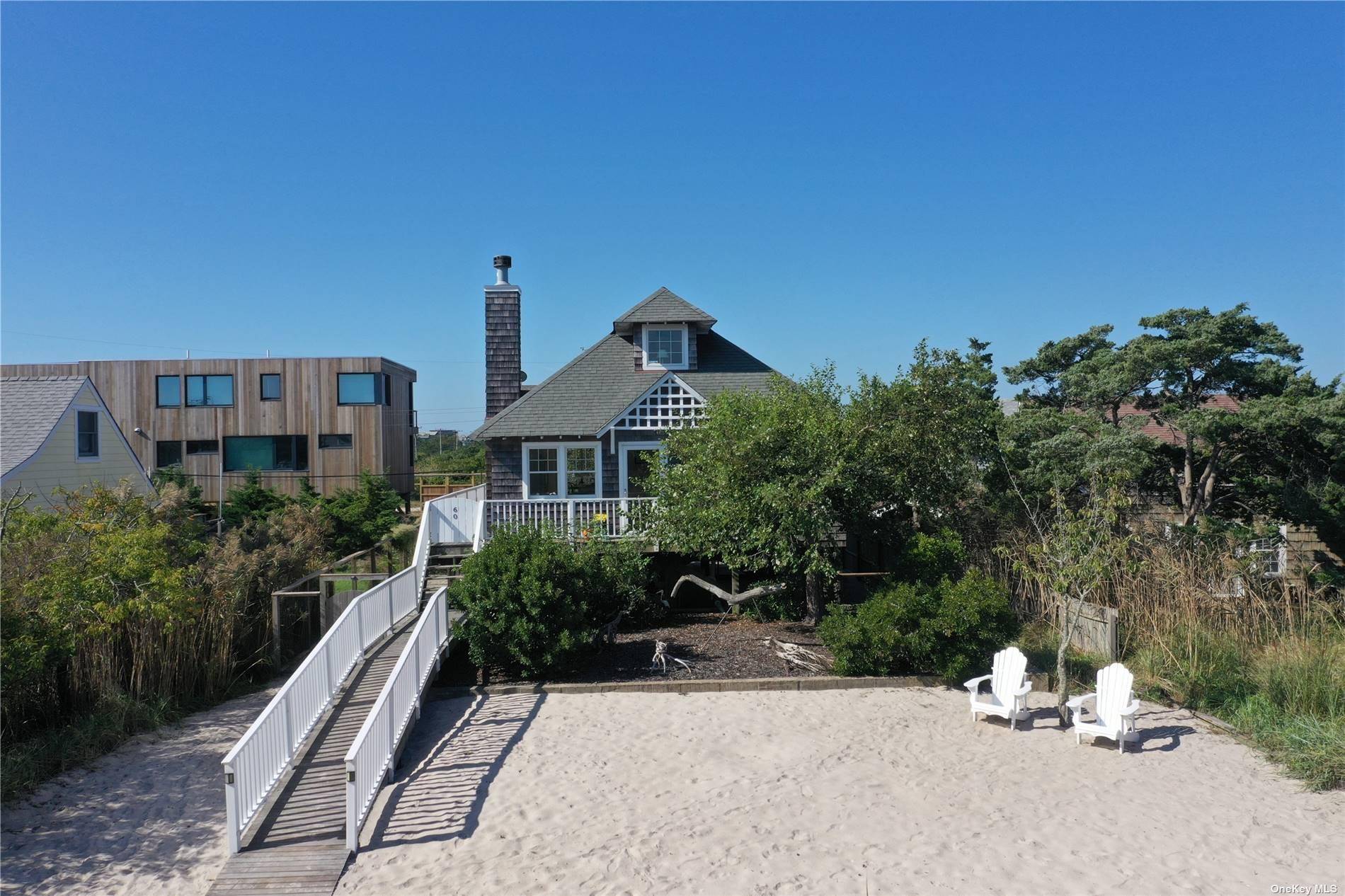 Nestled in the private community of Robbins Rest, this beach house boasts a sundrenched open floorplan from front to back, perfect for entertaining.