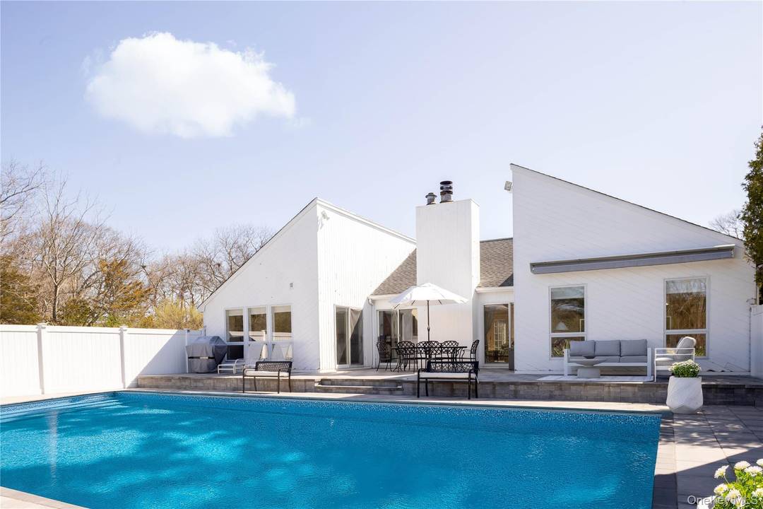 Welcome to 3 Clay Pit Road, a serene escape nestled in the sought after hamlet of Remsenburg.