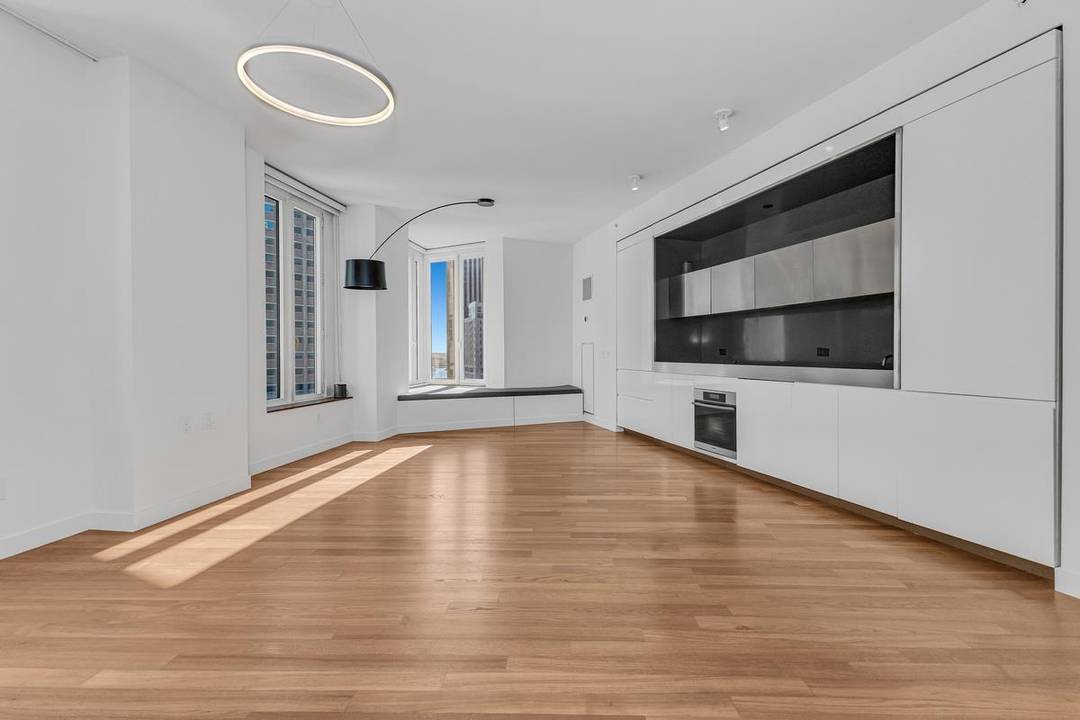 Residence 21E at 15 William Street is a spacious and light filled two bedroom, two bath home in one of Downtown Manhattan s premier full service condominiums.