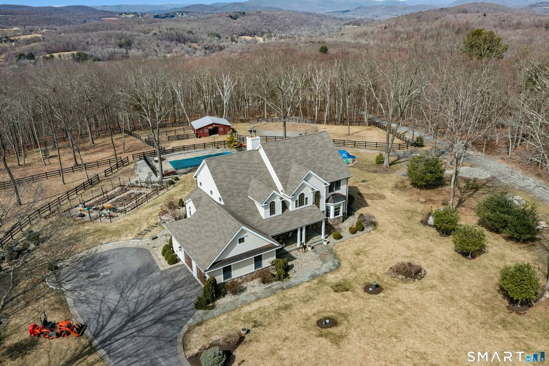 Sited on 7. 7 private acres on a quiet country lane, this impeccable 4 bedroom home has a sought after open floor plan on the first level.