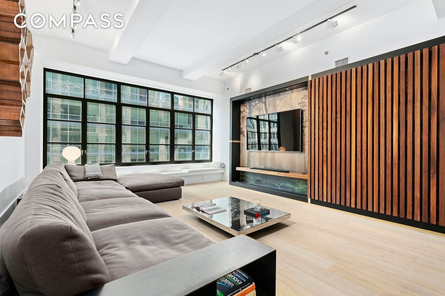 Sleek European styling and sprawling light filled living spaces make this designer three bedroom, two and a half bathroom residence a rare find in a full service NoMad condominium.