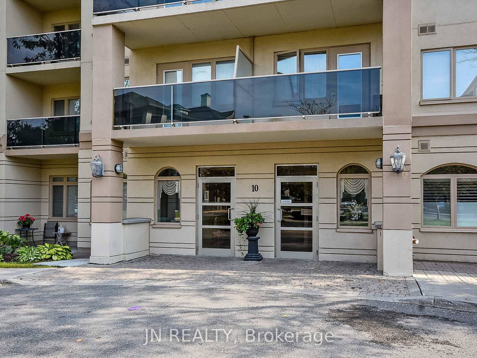 Step into this bright and spacious 1259 sq ft, ground level, corner unit condo offering the perfect blend of comfort and convenience.