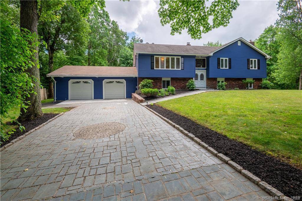 Tucked away in a peaceful and secluded part of Hamden, this expansive raised ranch offers the perfect blend of space, comfort, and natural beauty.