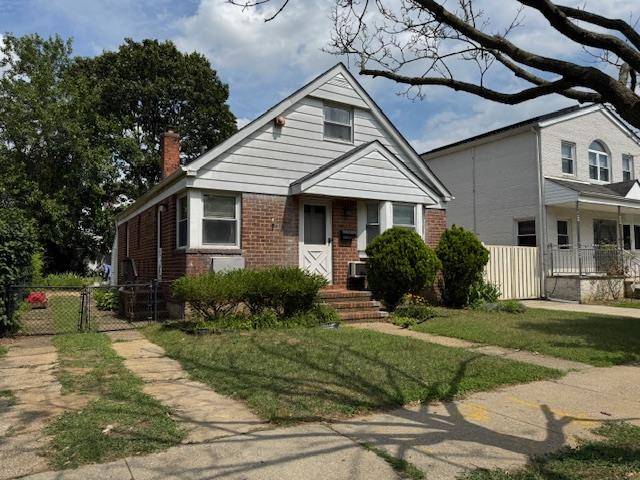 This charming brick cape is situated in the heart of Glen Oaks, Queens, and offers a perfect blend of comfort and convenience.