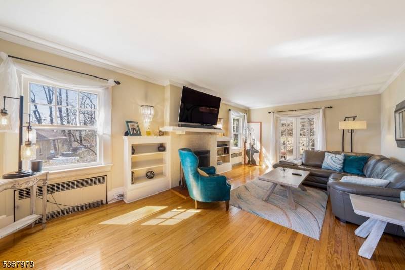 Welcome to this stunning and cozy Colonial nestled in the heart of Upper Montclair just three blocks from the train station offering direct access to NYC.