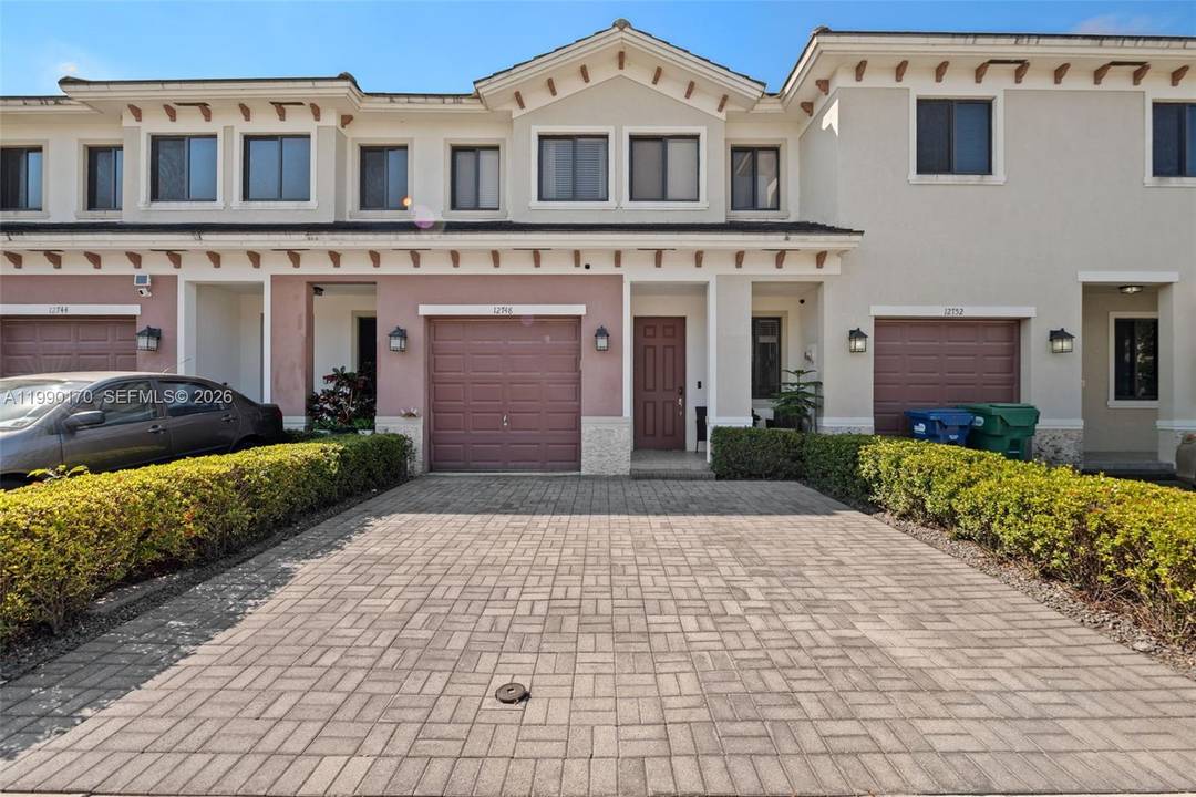 Elegant townhouse featuring granite countertops and stainless steel appliances.