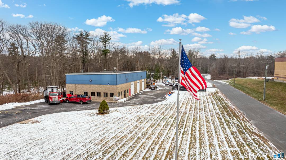 79 W Dudley Town Road, Bloomfield, CT offers a versatile commercial lease combining office and industrial space.