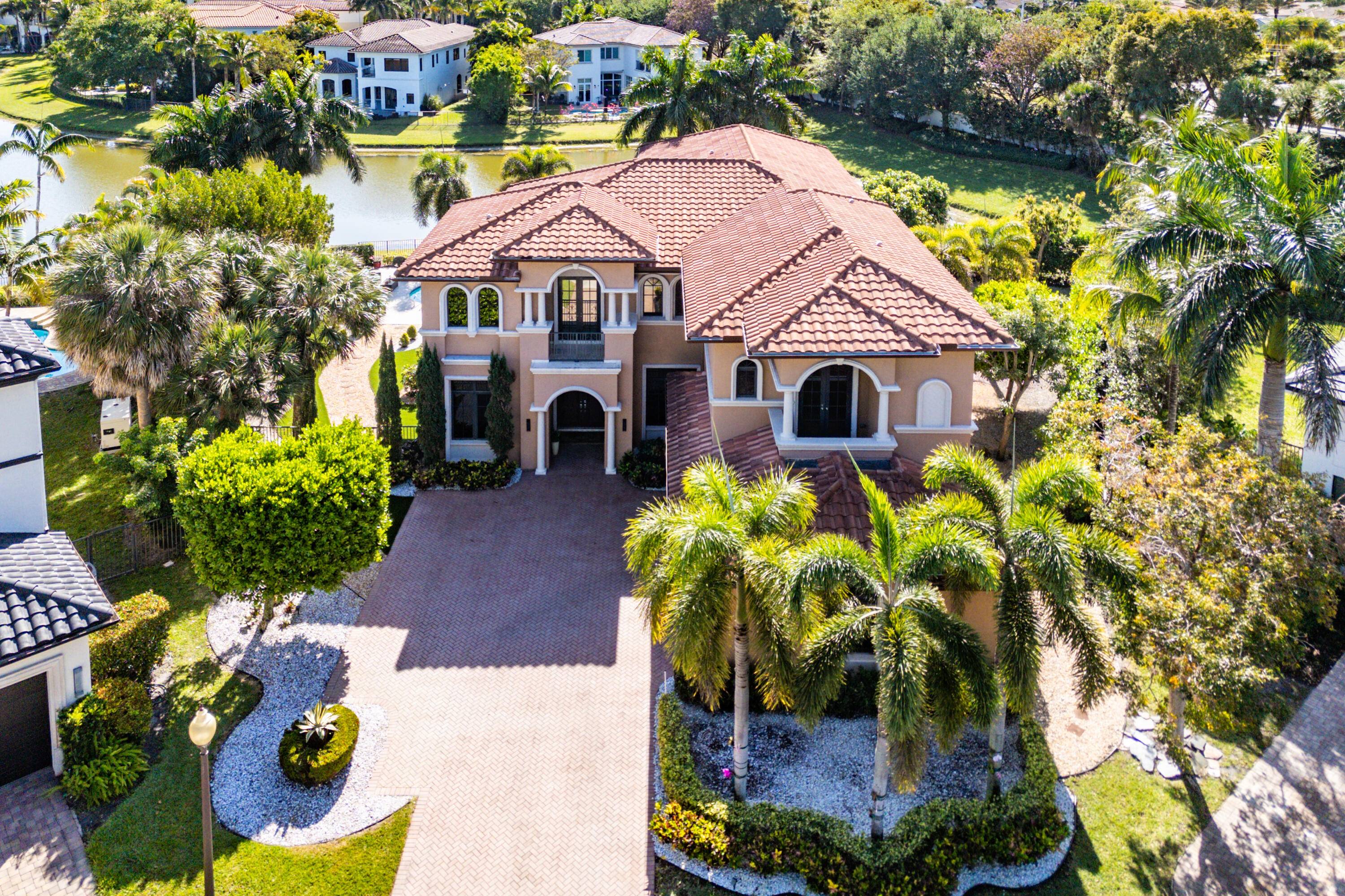 This rarely offered custom San Marco V is one of only two in The Oaks, perfectly situated on an exceptional cul de sac lakefront point lot.