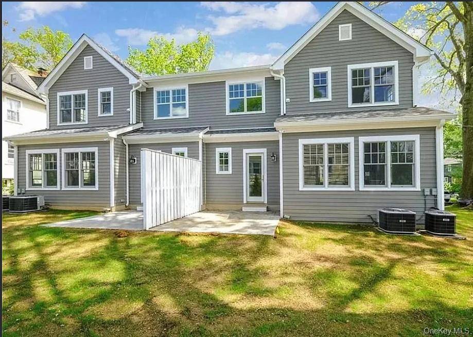 This bright, airy, and spacious townhouse in Rye Neck is designed to offer the feel of a single family residence.