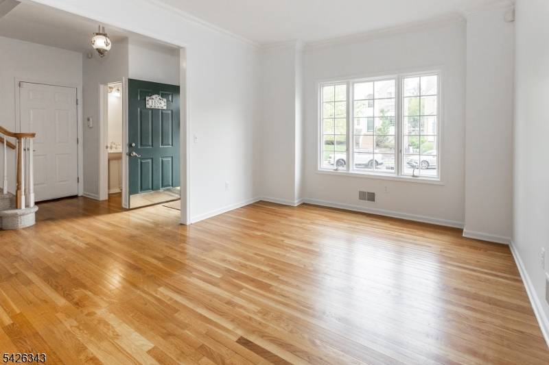 Discover elevated living at this stunning townhome nestled within the prestigious, gated Crown View Manor community in West Orange.