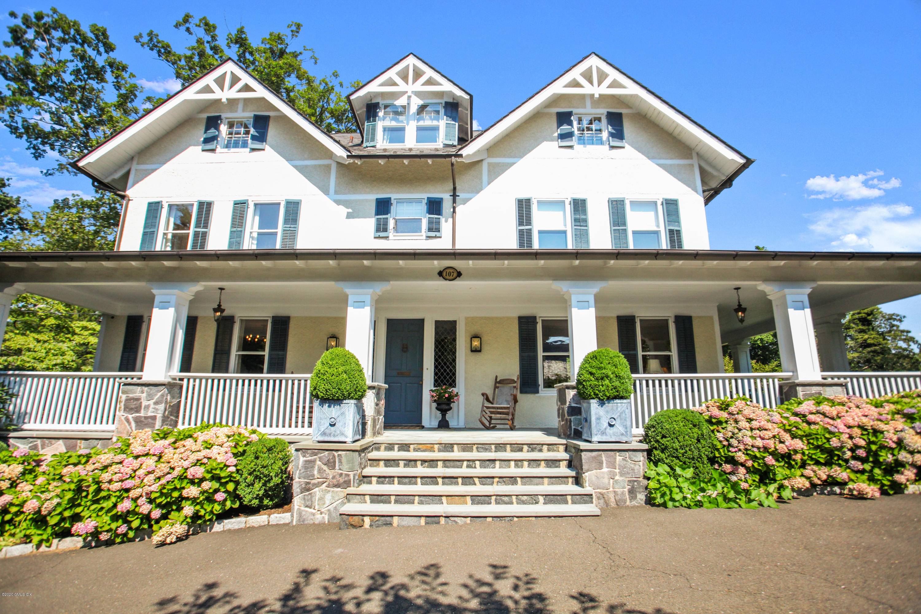 Impressive six bedroom pre war Colonial boasts wonderful outdoor living with pool, playground, wraparound veranda and fire pit on.