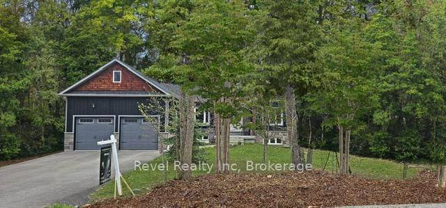 Welcome to this stunning bungalow in Tiny, Ontario the perfect blend of comfort, style, and convenience.