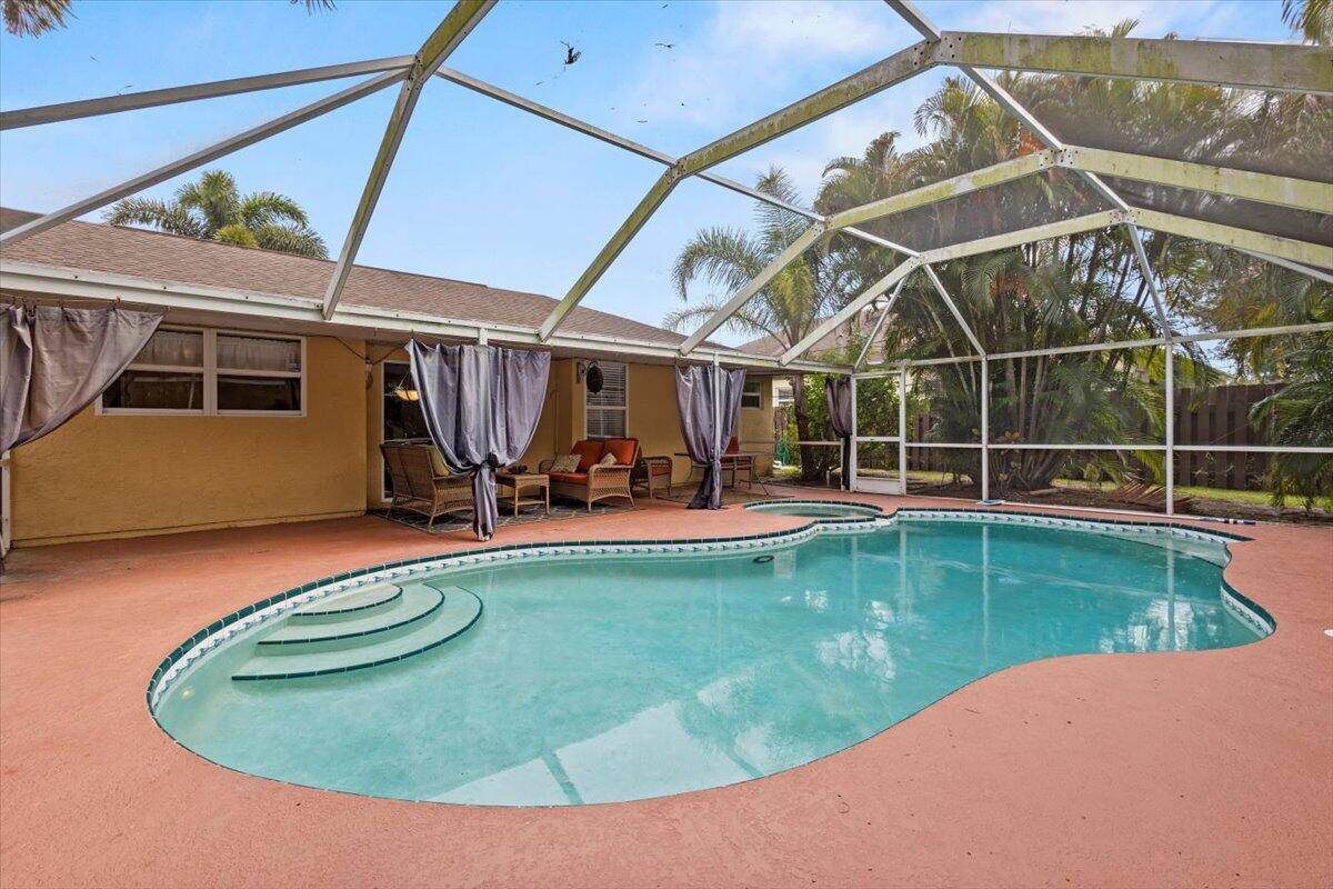 Live the Florida lifestyle in this 3BR, 2BA pool home on a large corner lot.
