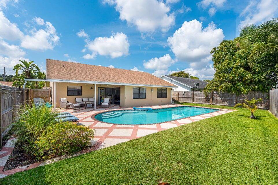 WOW ! BEAUTIFUL UPDATED POOL HOME ON AN OVER SIZED CORNER LOT.
