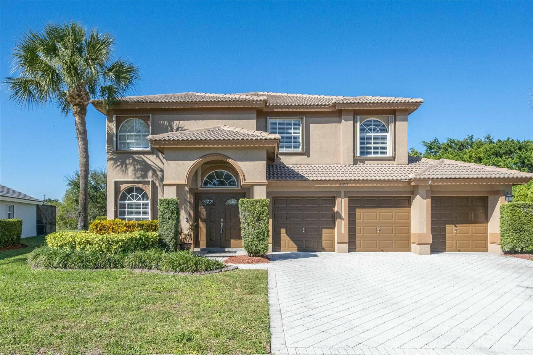 Beautiful pool home on an oversized preserve lakefront lot, fully fenced in the gated Grand Isles community.