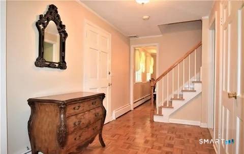 Well maintained Traditional Colonial with many updates located in a central location on a picturesque lot in the Hillandale area of town.