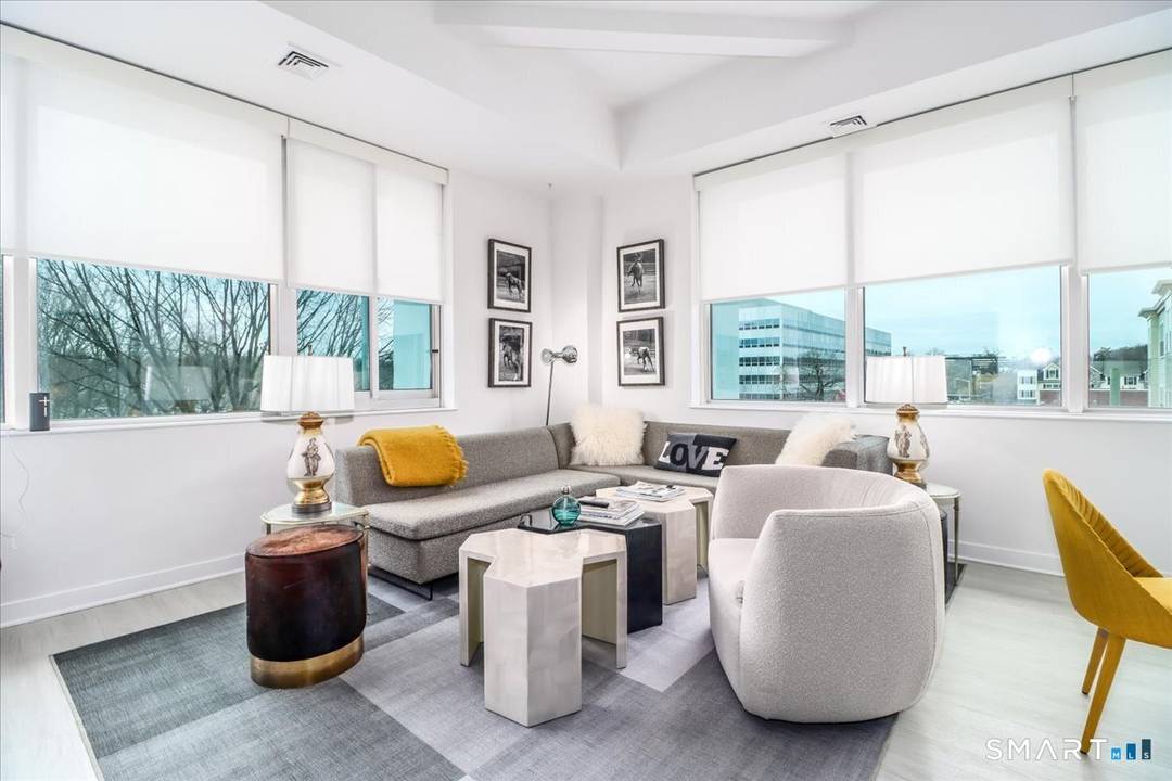 Sophisticated living can be yours in this sunny 2 bedroom, 2 bath flat featuring high ceilings, walls of noise reducing windows modern design for easy living entertaining.