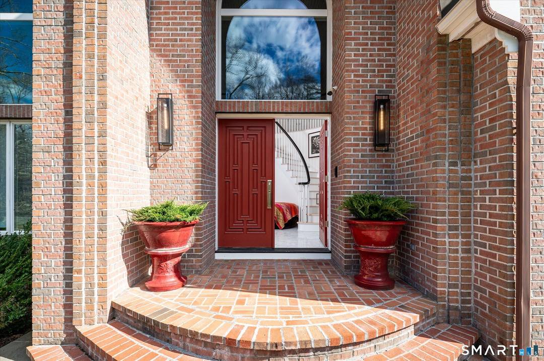 Lakefront living ! This elegant main home features 450 ft of private, pristine lakefront in a coveted area of North Stamford CT !