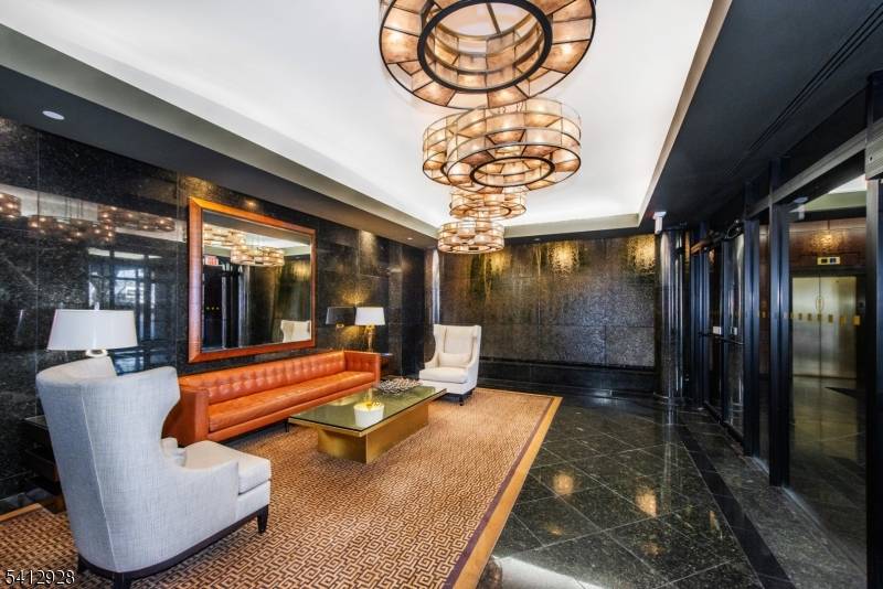 EXPERIENCE ELEVATED LIVING IN THIS SOPHISTICATED 2 BEDROOM, 2 BATH UPSCALE CONDO OFFERING SWEEPING NEW YORK VIEWS FROM BOTH THE LIVING ROOM, BEDROOMS AND PRIVATE TERRACE.