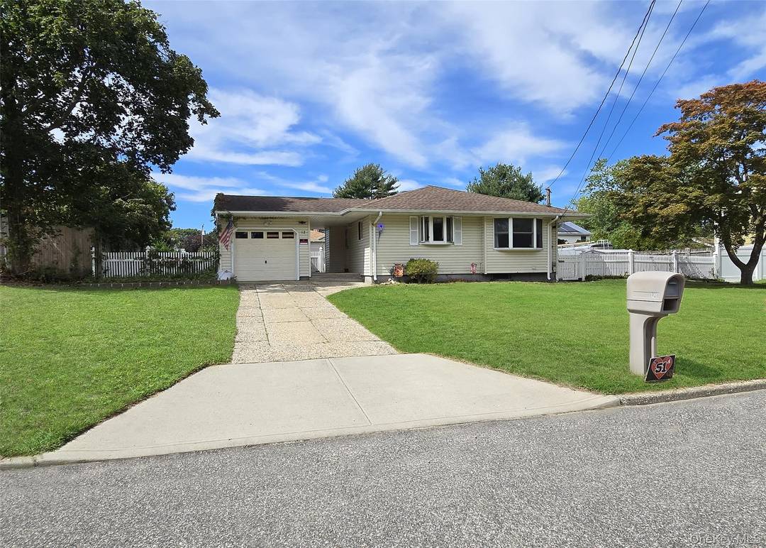 Welcome to 12 Choate Ave in Selden which features a large Eat in Kitchen with a skylight that includes updated cabinets and recess lighting.