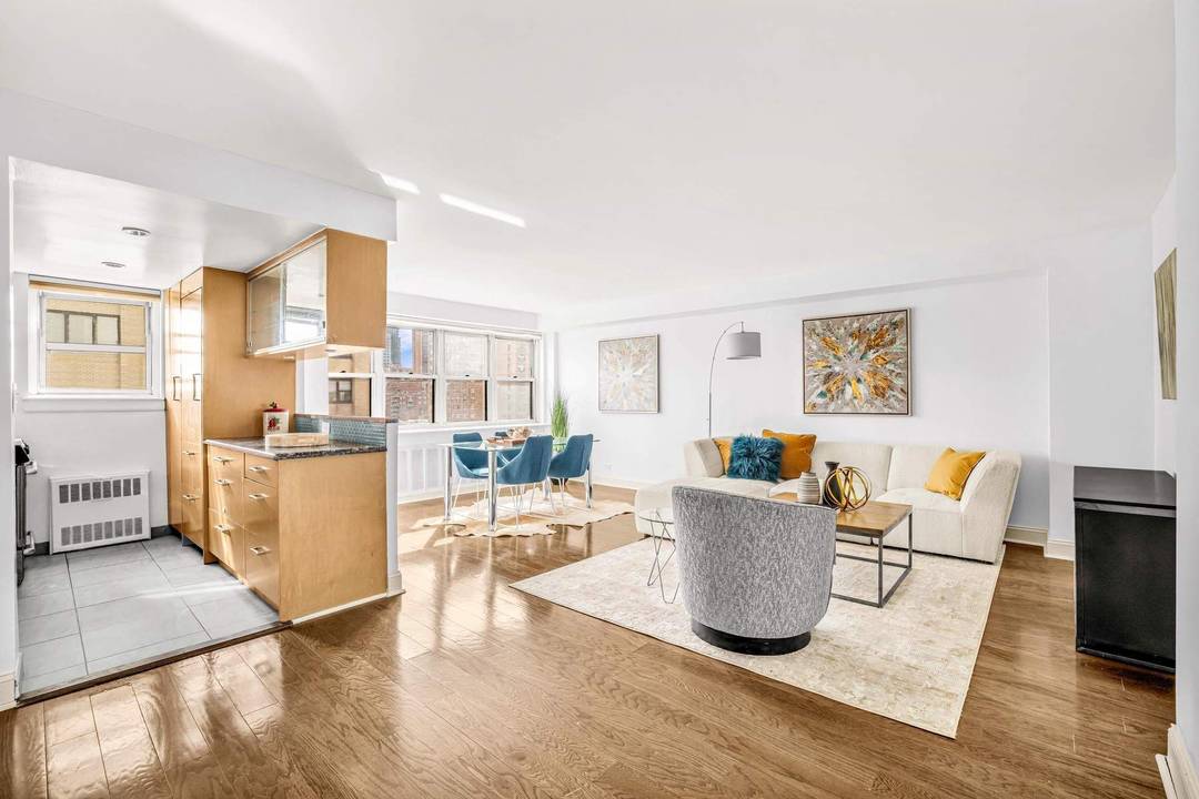 Apartment 21G is flooded with sunlight from the Southern and Eastern exposure with panoramic city and its Empire State Building views.