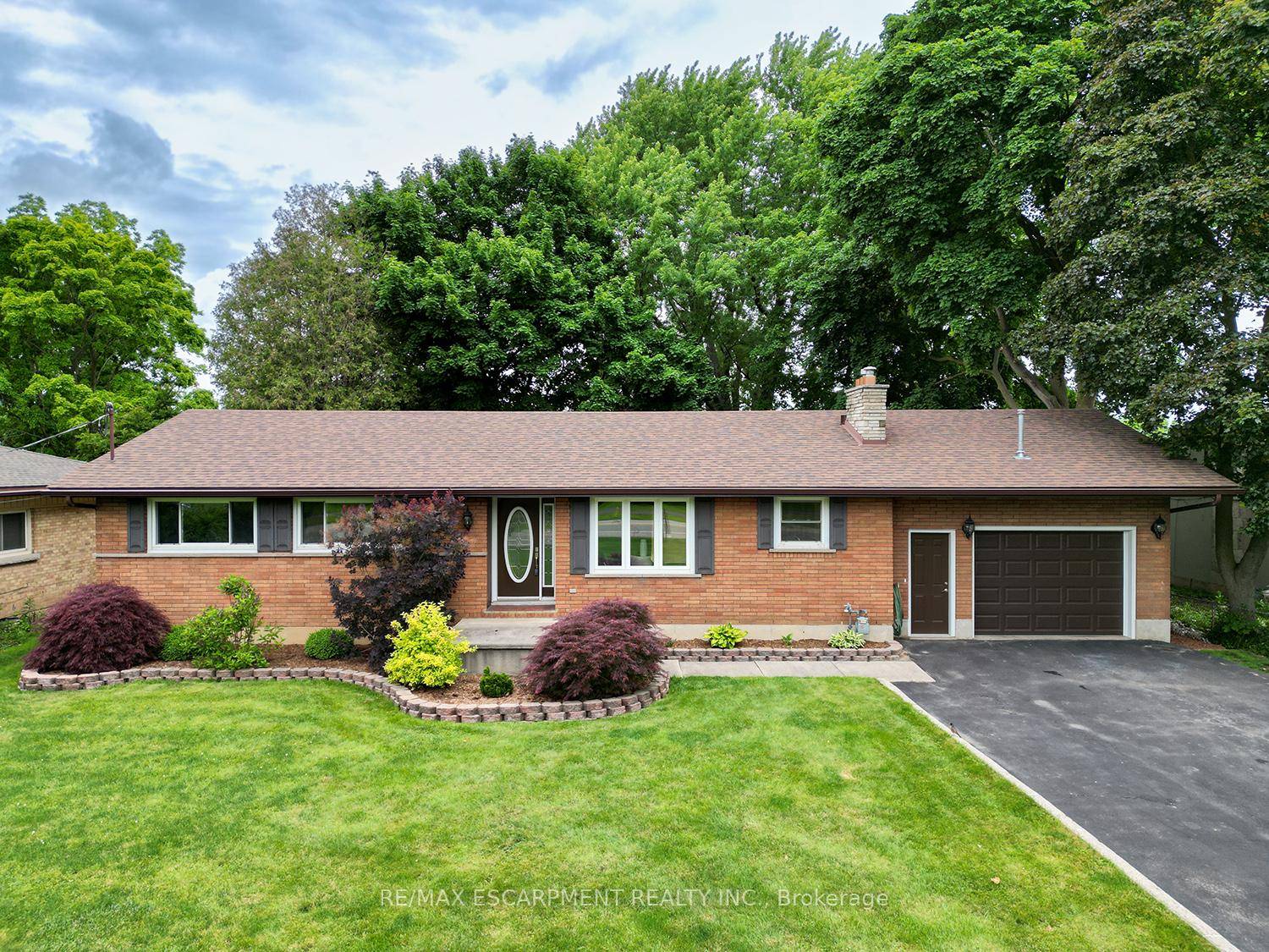 Welcome home to 445 Powerline Road, a handsome bungalow on a deep 185 ft lot in Brantford's North end, featuring a full brick exterior, double wide driveway, and an oversized ...