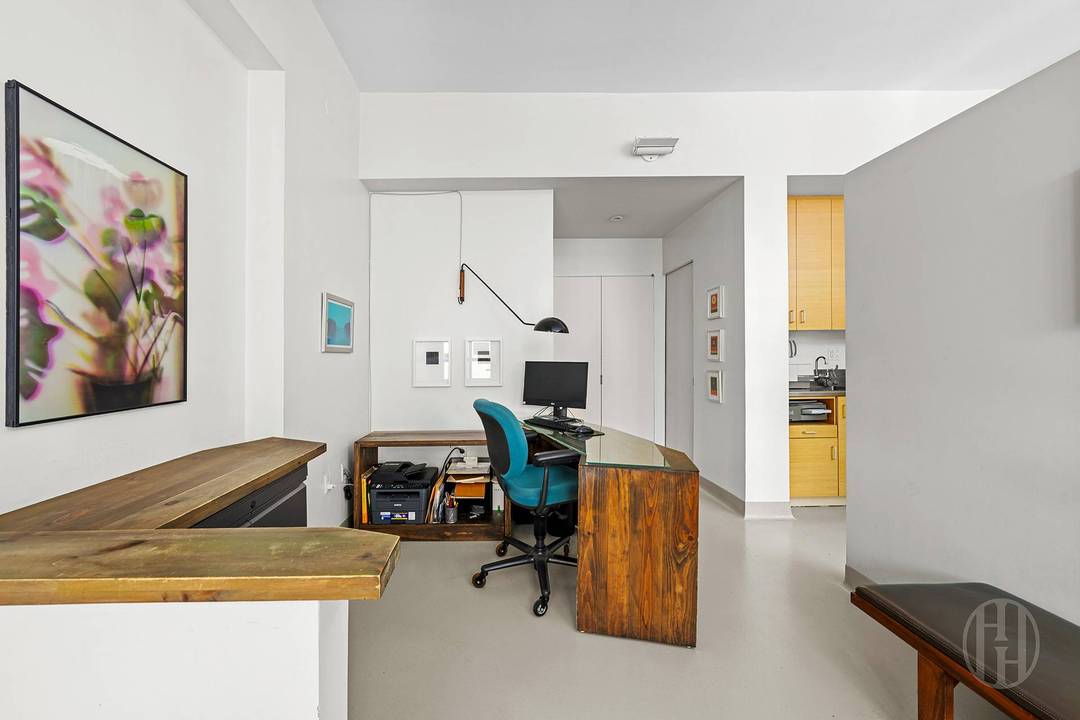 Spectacular Commercial Unit Welcome to Townhouse 1D at 367 West 49th Street a rare and versatile offering within the Worldwide Plaza Condominium.