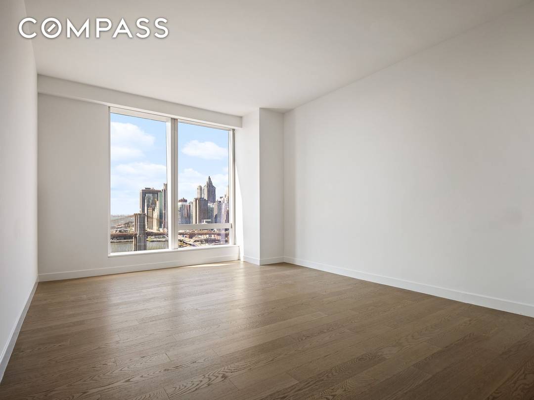 Residence 28C is a 695 square foot one bedroom, one bathroom home offering spectacular southwest facing views of the Manhattan Bridge and East River.