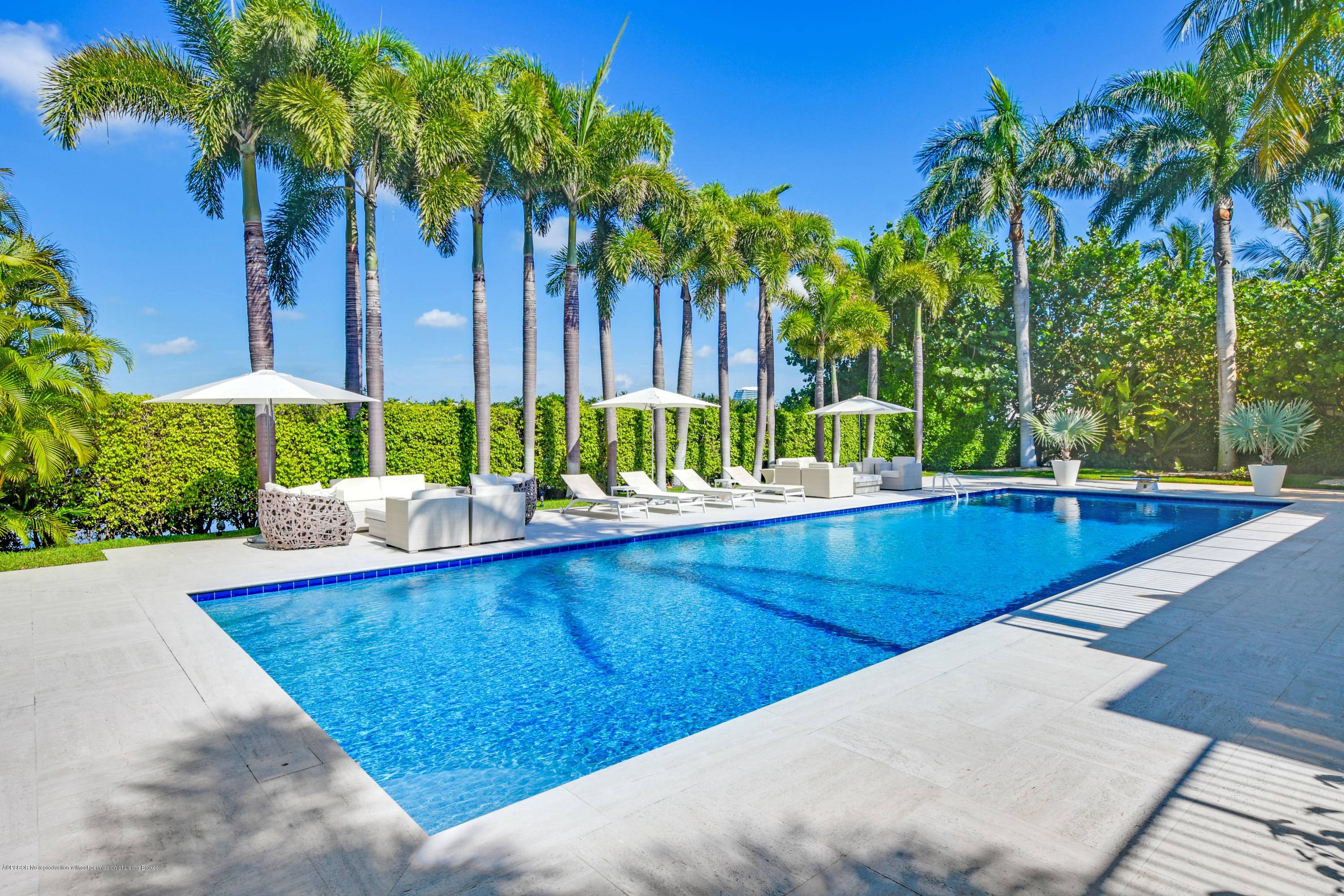 Beautiful John Volk lakefront residence located in the prestigious estate section on El Brillo Way.