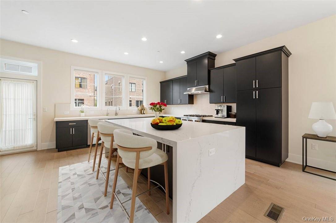 This exquisite end unit, bathed in natural light from its enviable east west orientation, presents a sophisticated blend of elegance and modern convenience that is unmatched.