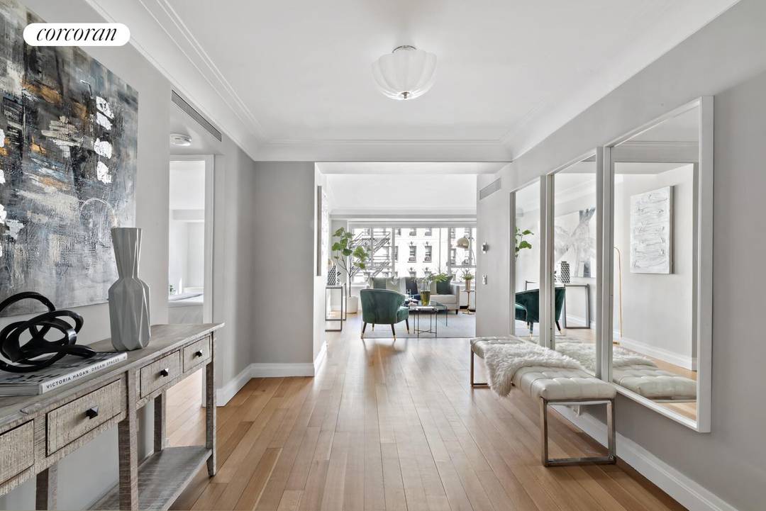 This beautiful split two bedroom, two bath home in the prestigious Manhattan House Condominium is flooded with light.
