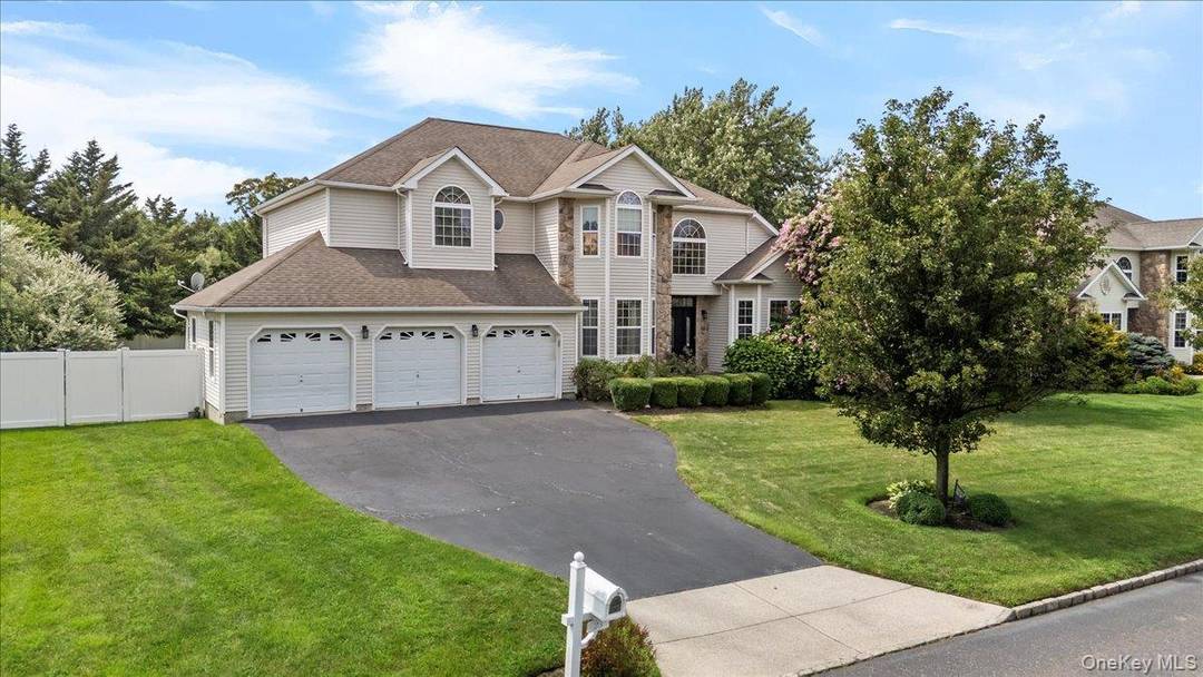 Welcome to Island Estates, where this impressive Colonial features 5 bedrooms and spacious living areas, complete with soaring ceilings and a striking staircase.