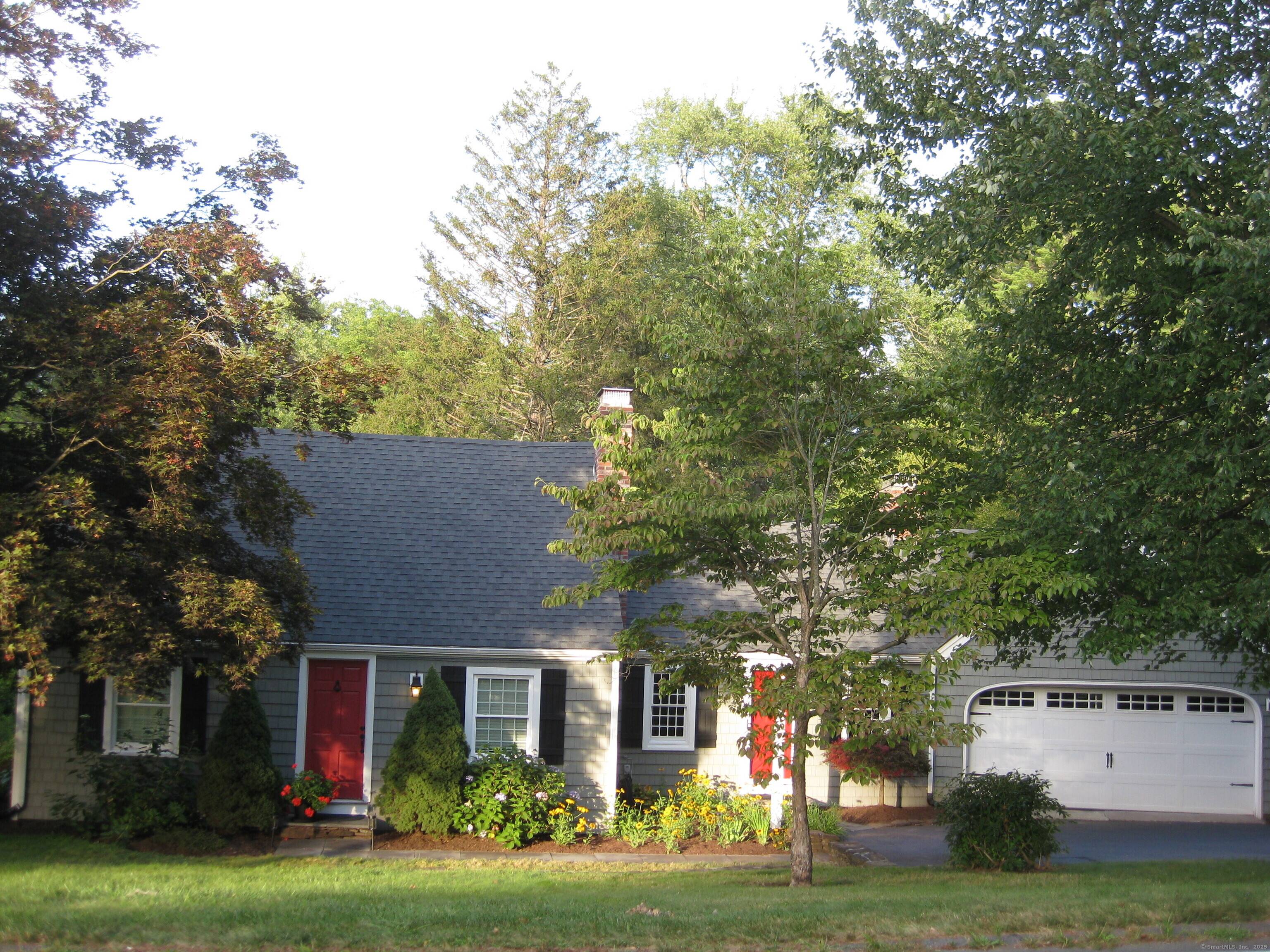 Located on one of Suffield's most desirable streets, just steps from Main Street and the Suffield Country Club, this classic New England Cape blends timeless character with modern comfort.