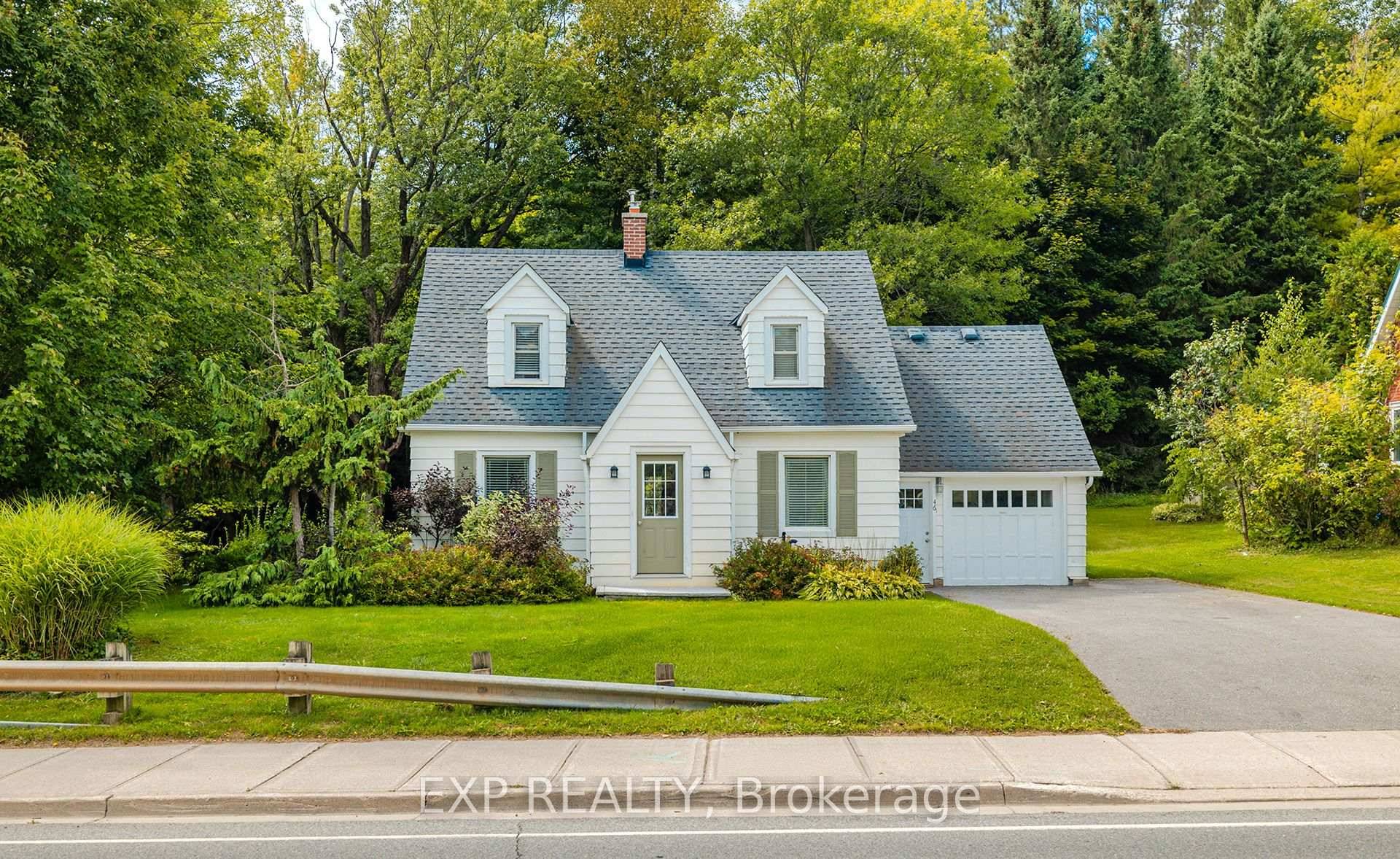 Nestled on 1. 8 landscaped acres with approx.