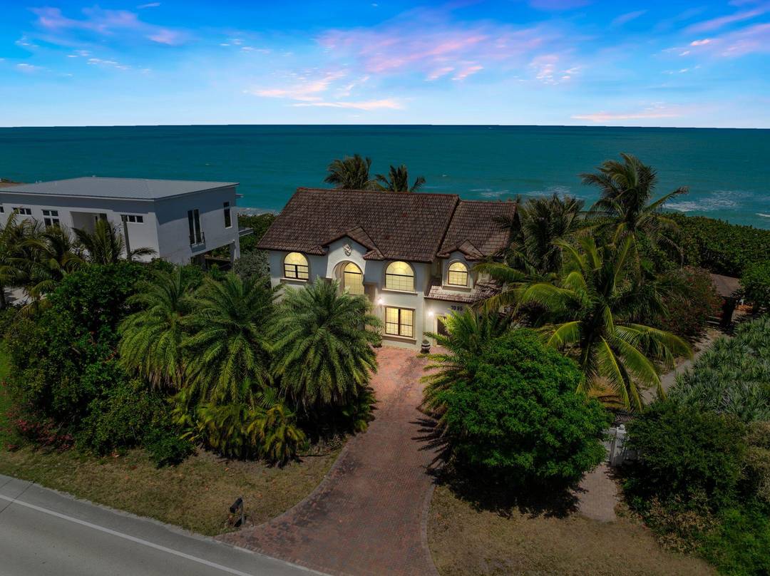 Discover unparalleled coastal luxury at this stunning oceanfront estate, nestled on a lush 1 2 acre beside a serene nature preserve amp ; no HOA.